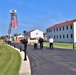 Firefighters and the American flag for Fort McCoy Garrison Change of Command ceremony