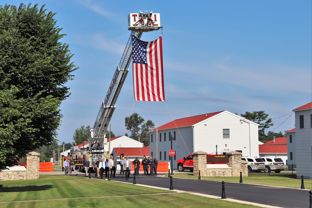 Firefighters and the American flag for Fort McCoy Garrison Change of Command ceremony