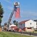 Firefighters and the American flag for Fort McCoy Garrison Change of Command ceremony