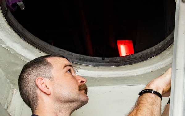 USS Ronald Reagan (CVN 76) Sailor conducts air flow monitoring