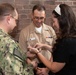 Musician 1st Class Franklin Silva and Musician 1st Class Nicholas Halbig are pinned upon arrival at U.S. Navy Band