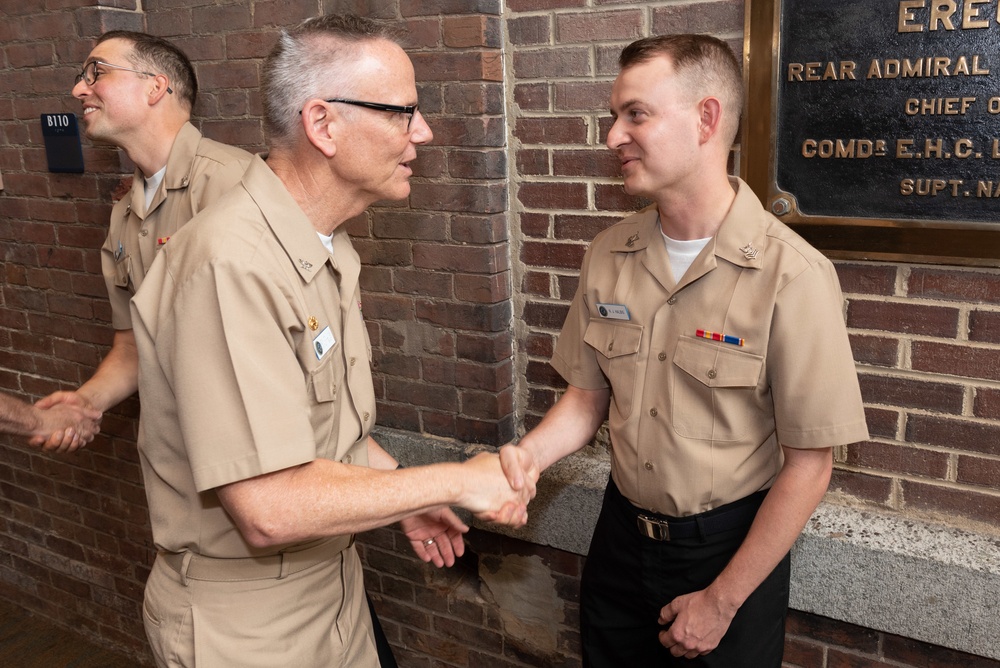 Musician 1st Class Franklin Silva and Musician 1st Class Nicholas Halbig are pinned upon arrival at U.S. Navy Band