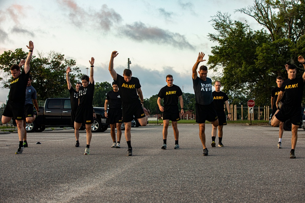 Maj. Gen. Brian Mennes does PT with Data Warfare Company Innovation Cadets