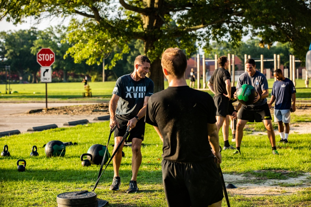 Maj. Gen. Brian Mennes does PT with Data Warfare Company Innovation Cadets