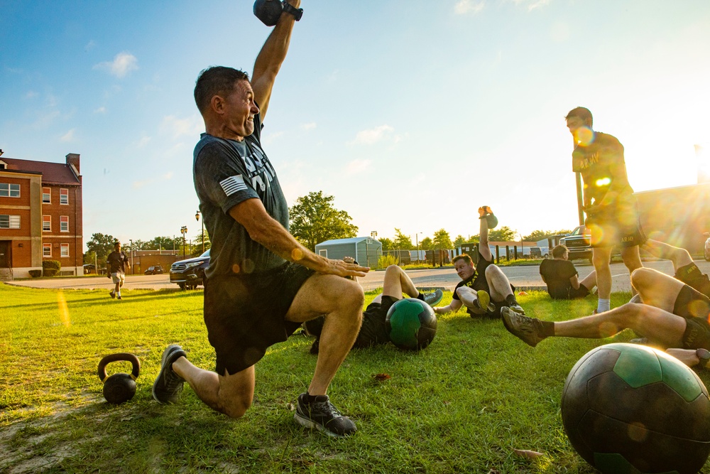 Maj. Gen. Brian Mennes does PT with Data Warfare Company Innovation Cadets