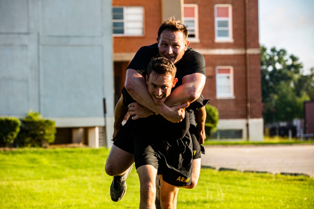 Maj. Gen. Brian Mennes does PT with Data Warfare Company Innovation Cadets