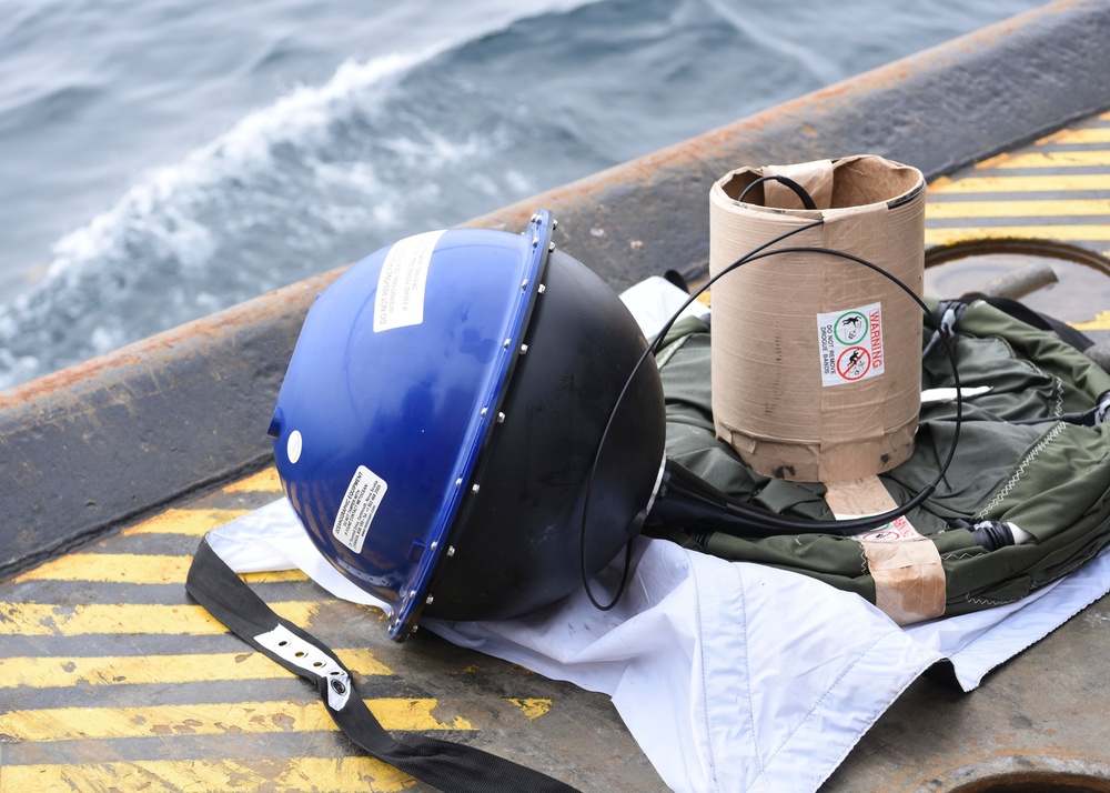 USCGC Oak (WLB 211) crew drops International Ice Patrol buoy near Greenland