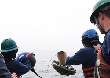 USCGC Oak (WLB 211) crew drops International Ice Patrol buoy near Greenland