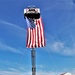 Firefighters and the American flag for Fort McCoy Garrison Change of Command ceremony