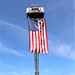 Firefighters and the American flag for Fort McCoy Garrison Change of Command ceremony