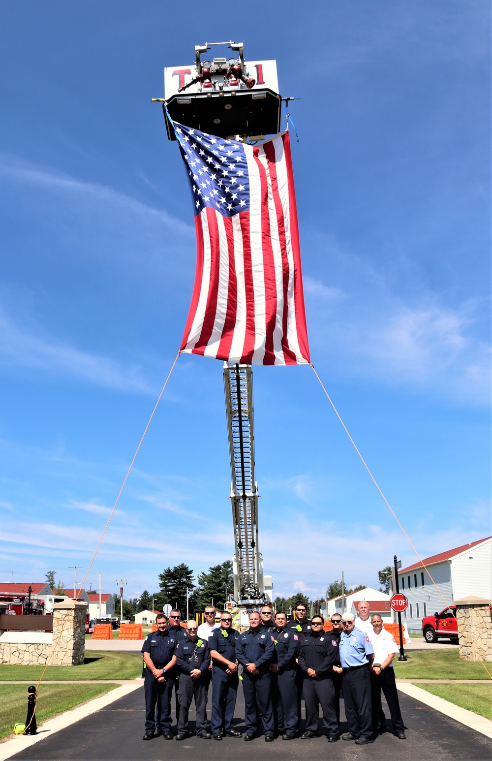 Firefighters and the American flag for Fort McCoy Garrison Change of Command ceremony