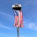 Firefighters and the American flag for Fort McCoy Garrison Change of Command ceremony