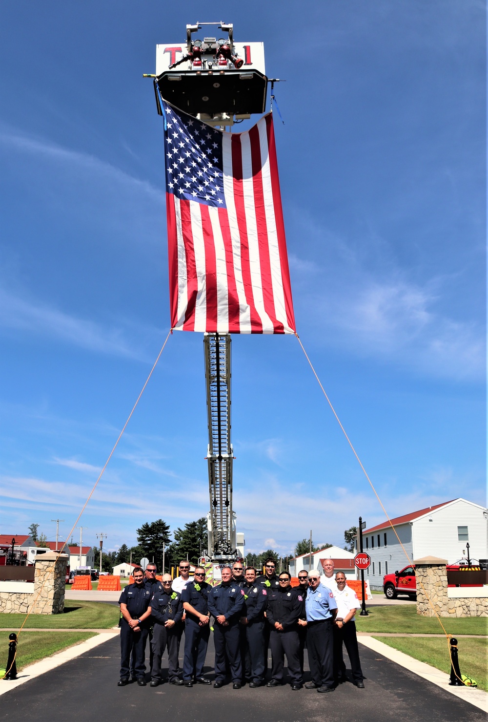 Firefighters and the American flag for Fort McCoy Garrison Change of Command ceremony