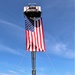 Firefighters and the American flag for Fort McCoy Garrison Change of Command ceremony