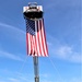 Firefighters and the American flag for Fort McCoy Garrison Change of Command ceremony