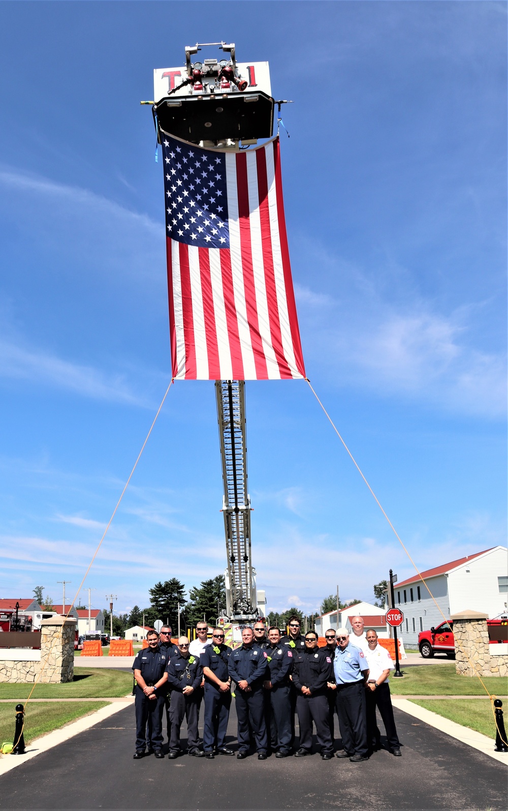 Firefighters and the American flag for Fort McCoy Garrison Change of Command ceremony