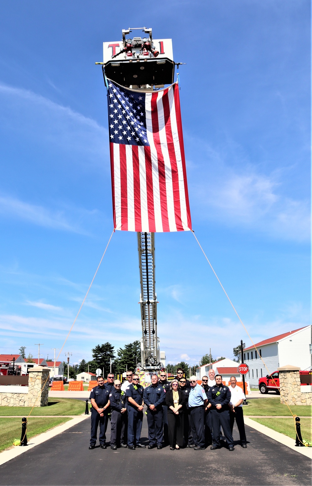 Firefighters and the American flag for Fort McCoy Garrison Change of Command ceremony