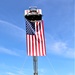 Firefighters and the American flag for Fort McCoy Garrison Change of Command ceremony