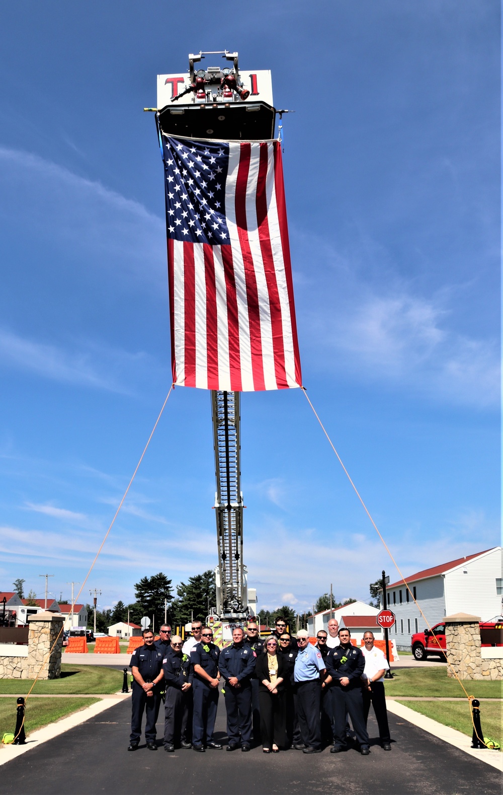 Firefighters and the American flag for Fort McCoy Garrison Change of Command ceremony