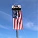 Firefighters and the American flag for Fort McCoy Garrison Change of Command ceremony