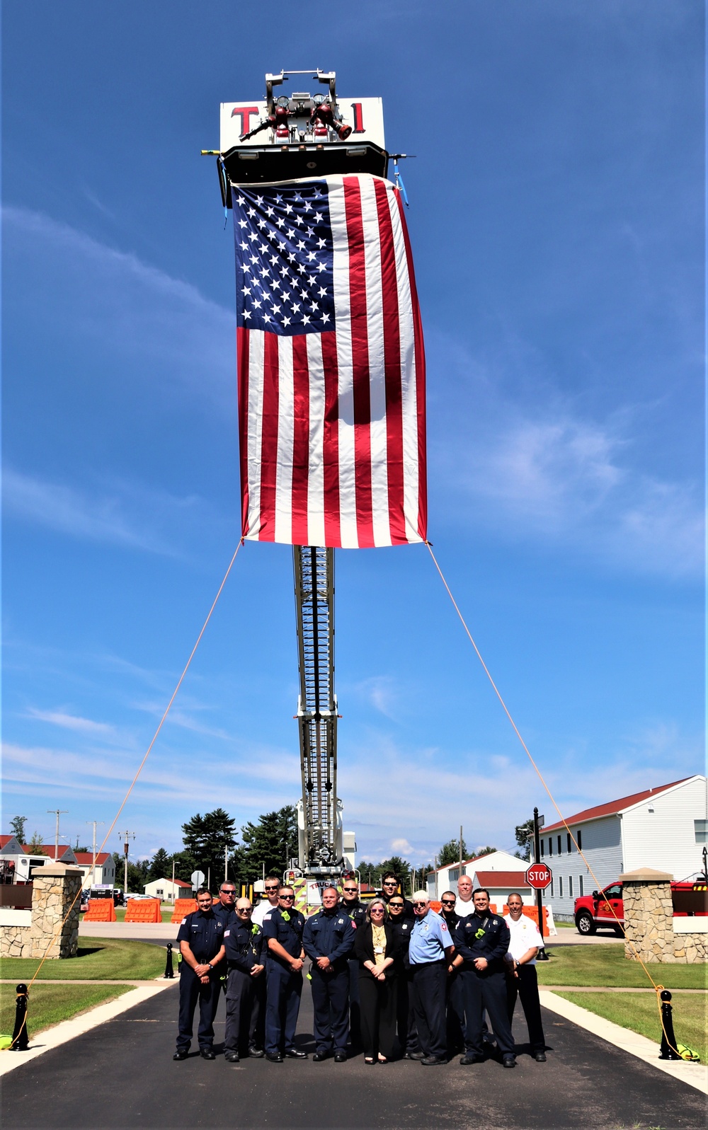Firefighters and the American flag for Fort McCoy Garrison Change of Command ceremony