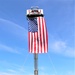 Firefighters and the American flag for Fort McCoy Garrison Change of Command ceremony
