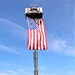 Firefighters and the American flag for Fort McCoy Garrison Change of Command ceremony
