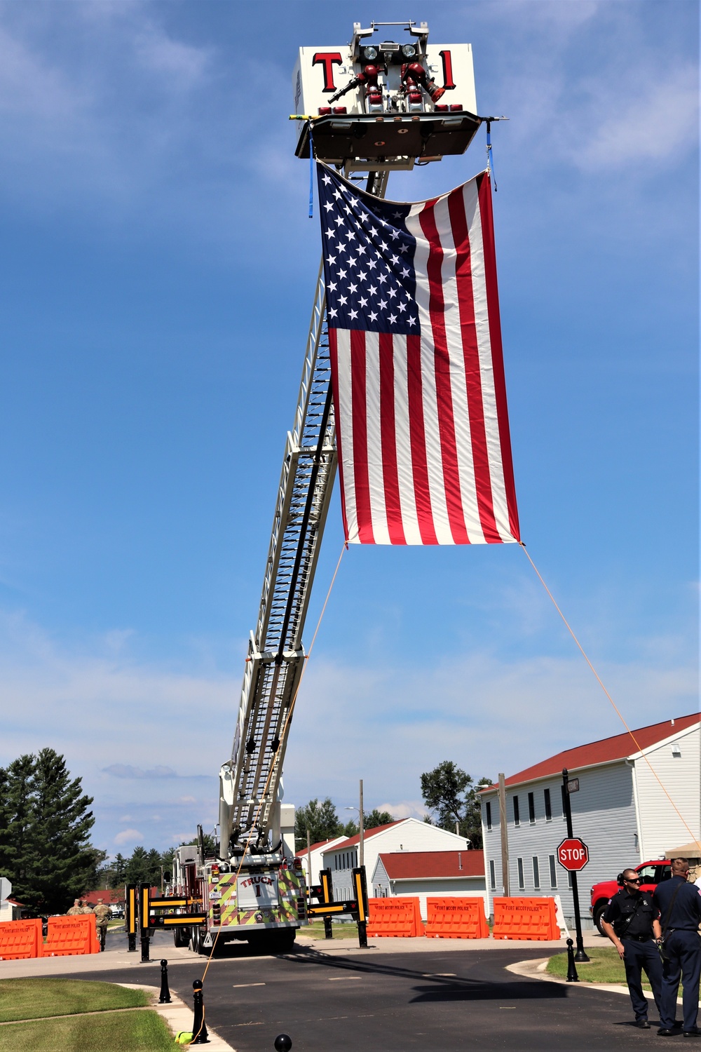 Firefighters and the American flag for Fort McCoy Garrison Change of Command ceremony