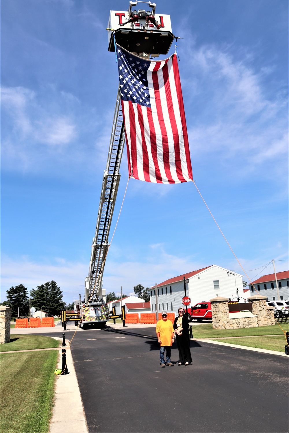 Firefighters and the American flag for Fort McCoy Garrison Change of Command ceremony