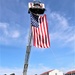Firefighters and the American flag for Fort McCoy Garrison Change of Command ceremony