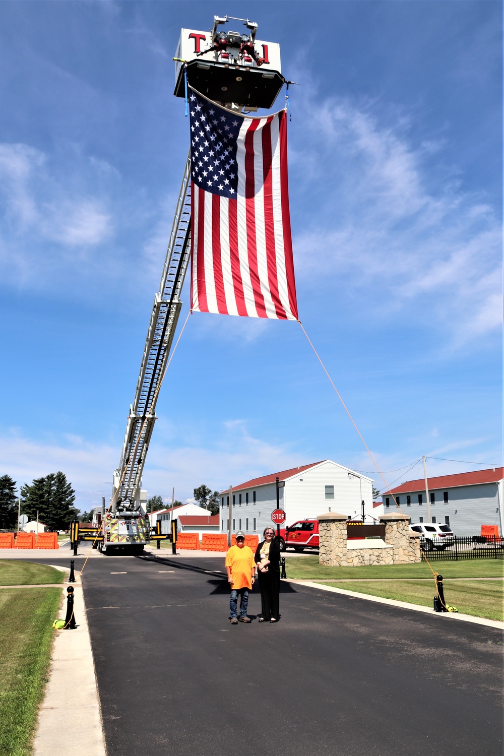 Firefighters and the American flag for Fort McCoy Garrison Change of Command ceremony