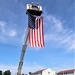Firefighters and the American flag for Fort McCoy Garrison Change of Command ceremony
