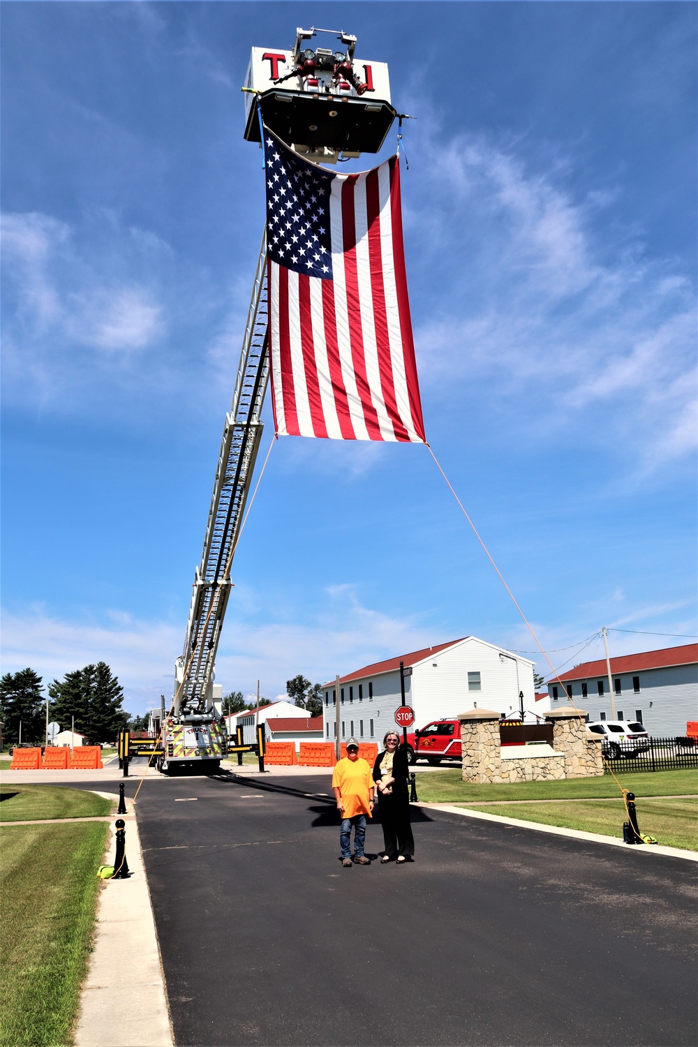 Firefighters and the American flag for Fort McCoy Garrison Change of Command ceremony