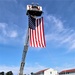 Firefighters and the American flag for Fort McCoy Garrison Change of Command ceremony