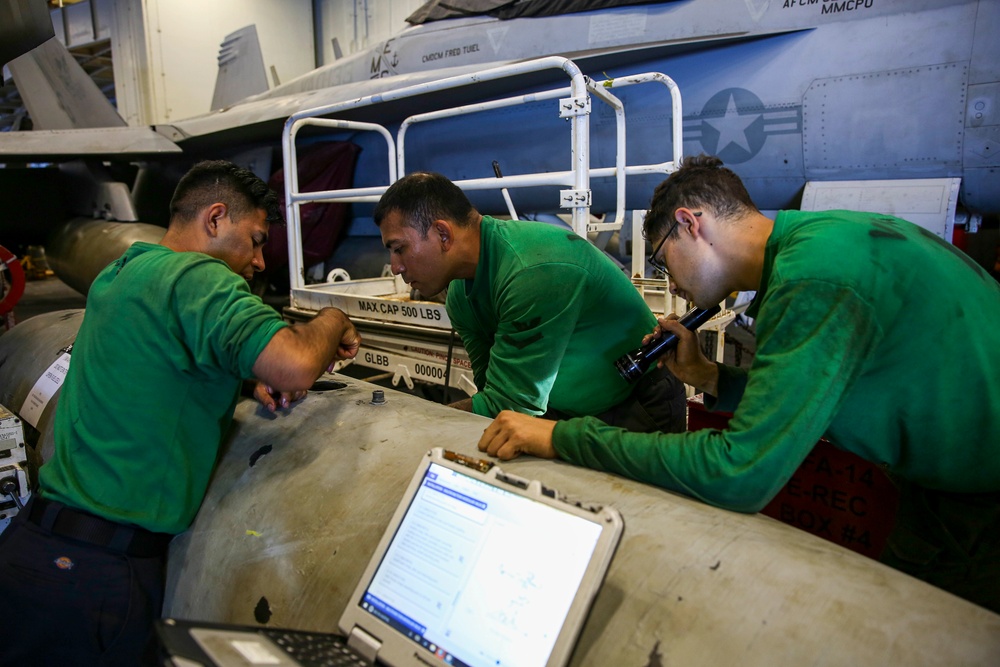 Abraham Lincoln Sailors conduct aircraft maintenance