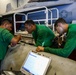 Abraham Lincoln Sailors conduct aircraft maintenance