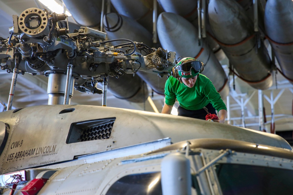 Abraham Lincoln Sailors conduct aircraft maintenance