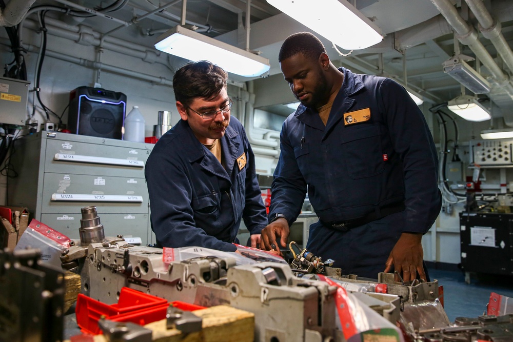 Abraham Lincoln Sailors conduct aircraft maintenance