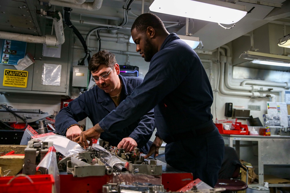 Abraham Lincoln Sailors conduct aircraft maintenance