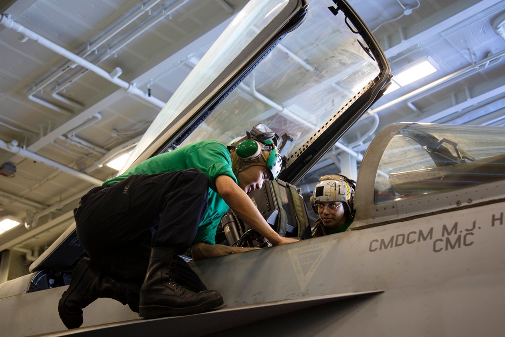 Abraham Lincoln Sailors conduct aircraft maintenance