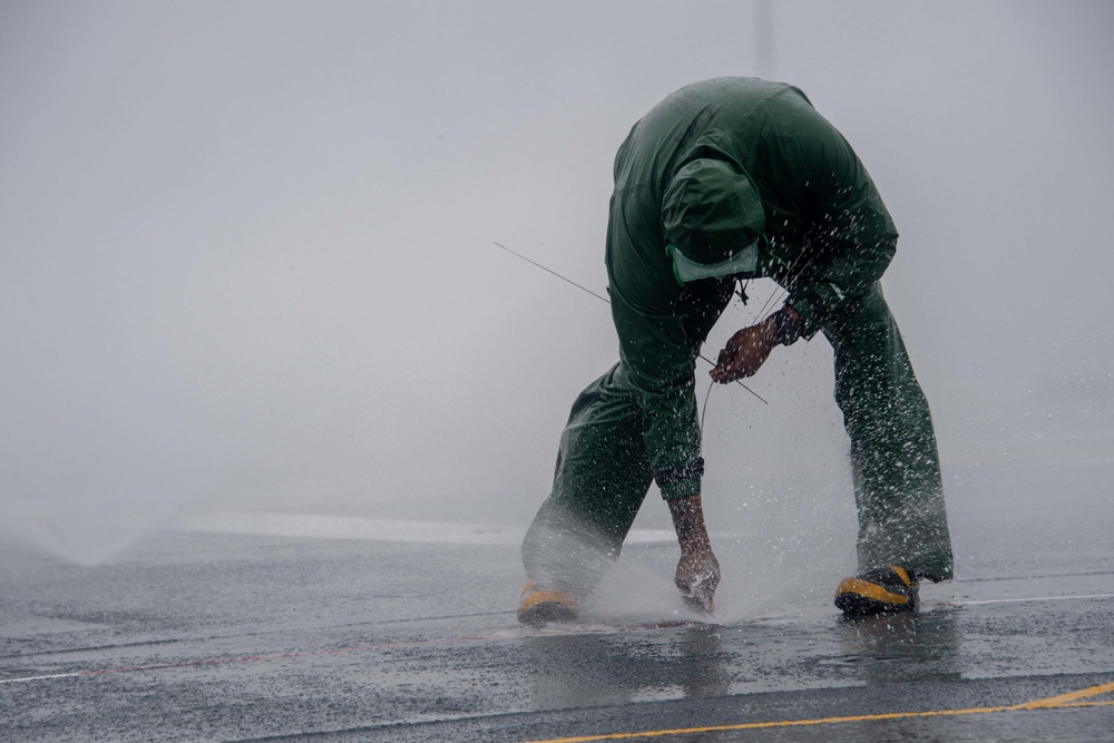 USS America (LHA 6) Sailors Conduct Counter Measure Wash Down
