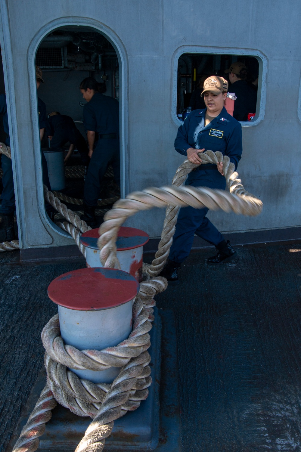 Sailor Removes Line From Bollard