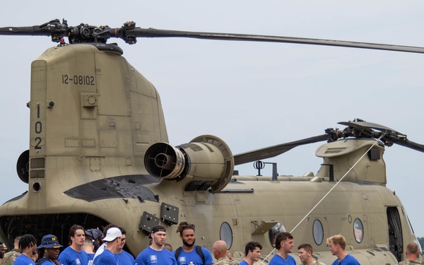 UM football team visits Grand Valley Armory