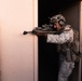 Marines conduct urban terrain combat training during MWX 3-22