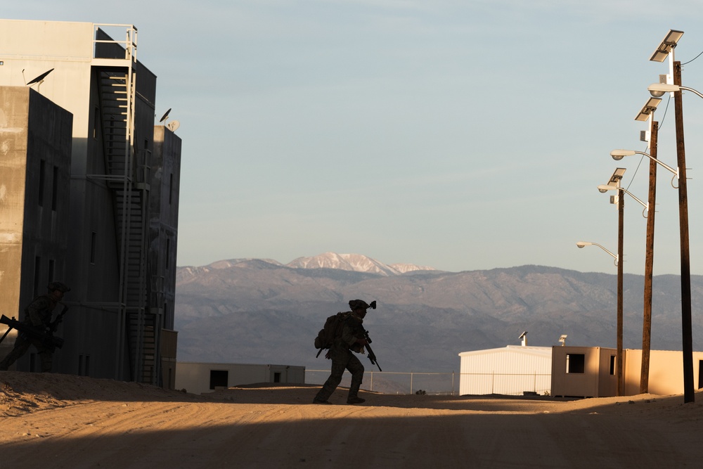 Marines conduct urban terrain combat training during MWX 3-22