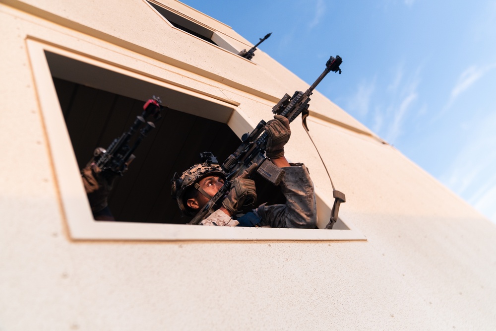 Marines conduct urban terrain combat training during MWX 3-22