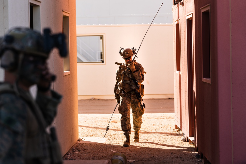 Marines conduct urban terrain combat training during MWX 3-22