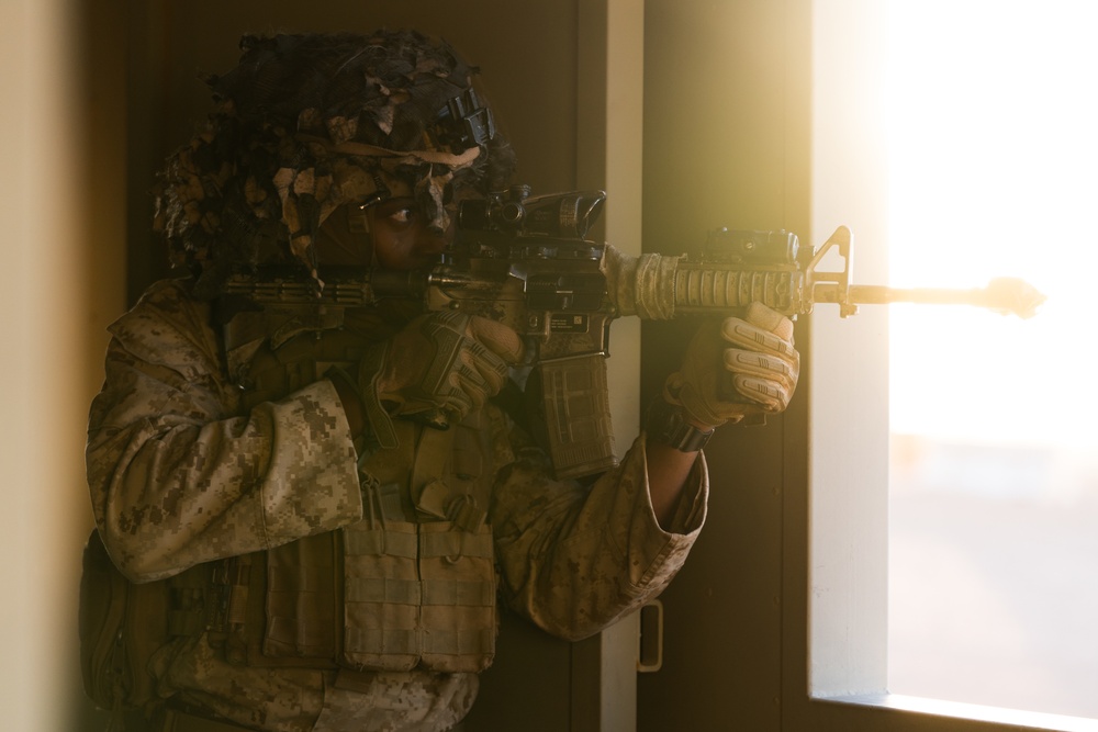 Marines conduct urban terrain combat training during MWX 3-22