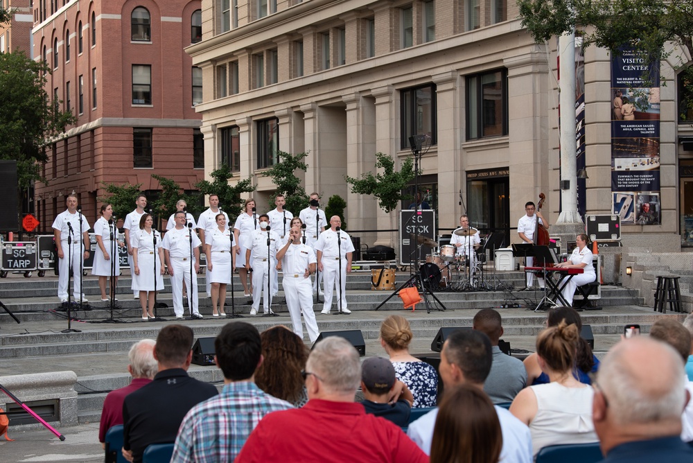 U.S. Navy Band Sea Chanters Chorus performs at the U.S. Navy Memorial Plaza