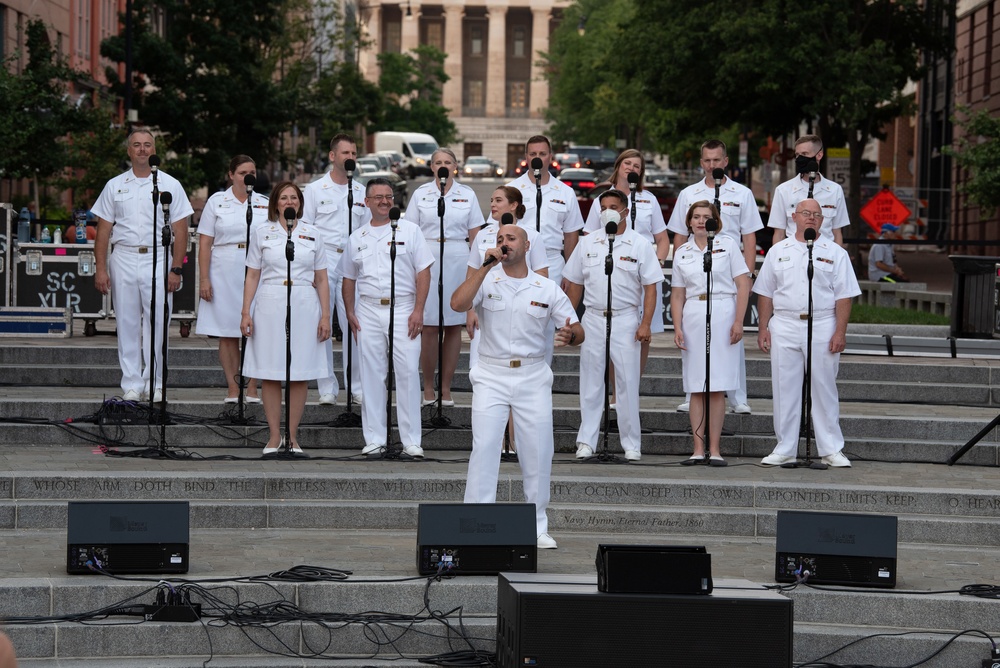 U.S. Navy Band Sea Chanters Chorus performs at the U.S. Navy Memorial Plaza